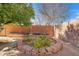 Landscaped backyard with a raised garden bed at 8344 E Indianola Ave, Scottsdale, AZ 85251