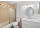 Bathroom with a shower/tub combo, white vanity, and gold accents at 8344 E Indianola Ave, Scottsdale, AZ 85251