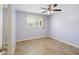 Bedroom with tiled floors, lavender walls, and ceiling fan at 8344 E Indianola Ave, Scottsdale, AZ 85251