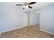 Bedroom with tiled floors, light blue walls, and mirrored closet at 8344 E Indianola Ave, Scottsdale, AZ 85251