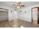 Bedroom with tiled floor, mirrored closet, and ensuite bathroom access at 8344 E Indianola Ave, Scottsdale, AZ 85251