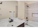 Well-lit bathroom featuring a shower-tub combo with neutral tile surround and a built-in niche at 8606 S 30Th St, Phoenix, AZ 85042