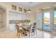 Bright dining area features stylish lighting, built-in cabinetry, and direct access to outdoor living spaces at 8606 S 30Th St, Phoenix, AZ 85042