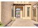 Stunning entry featuring a double door, brickwork, and desert landscaping at 8606 S 30Th St, Phoenix, AZ 85042