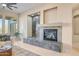 Cozy living room featuring a modern fireplace and large windows offering scenic views at 8606 S 30Th St, Phoenix, AZ 85042