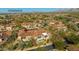 Stunning aerial view of a property with a terracotta roof and lush landscaping at 8923 E Mountain Spring Rd, Scottsdale, AZ 85255