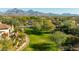 Expansive backyard featuring lush green grass, mature trees, and serene views at 8923 E Mountain Spring Rd, Scottsdale, AZ 85255