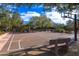 Outdoor basketball court surrounded by trees, benches, and park amenities at 8923 E Mountain Spring Rd, Scottsdale, AZ 85255