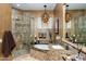 Elegant bathroom featuring a glass shower, soaking tub, and stylish chandelier at 8923 E Mountain Spring Rd, Scottsdale, AZ 85255