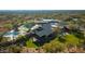 Aerial view of a modern community center with a pool, patio and well-maintained landscaping at 8923 E Mountain Spring Rd, Scottsdale, AZ 85255