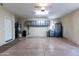 Spacious three car garage with epoxy floor and cabinets for storage at 8923 E Mountain Spring Rd, Scottsdale, AZ 85255