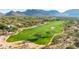 Scenic aerial view of a lush golf course with sand traps and mature trees at 8923 E Mountain Spring Rd, Scottsdale, AZ 85255