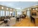 Bright open-plan living room featuring hardwood floors, fireplace, dining area and lots of natural light at 8923 E Mountain Spring Rd, Scottsdale, AZ 85255