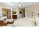 Serene main bedroom with a private balcony, decorative wall art, and a large window at 8923 E Mountain Spring Rd, Scottsdale, AZ 85255