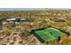 Aerial view of community tennis and pickleball courts, surrounded by desert landscaping at 8923 E Mountain Spring Rd, Scottsdale, AZ 85255