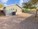 Simple backyard with gravel and a covered patio area at 9023 W Hubbell St, Phoenix, AZ 85037