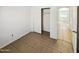 Bright bedroom with tile flooring and a spacious closet at 9023 W Hubbell St, Phoenix, AZ 85037