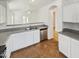 Kitchen features a double sink, stainless steel dishwasher, and white cabinets at 9023 W Hubbell St, Phoenix, AZ 85037