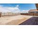 Large, open backyard with block fencing, offering privacy and potential at 9054 S 169Th Dr, Goodyear, AZ 85338