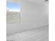 Bedroom with plush carpet, base molding, and window overlooking the backyard at 9054 S 169Th Dr, Goodyear, AZ 85338