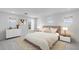 Serene bedroom featuring a comfortable bed, soft lighting, and three windows providing natural light at 9054 S 169Th Dr, Goodyear, AZ 85338