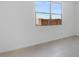Bright bedroom featuring wood floors and one large window at 9054 S 169Th Dr, Goodyear, AZ 85338