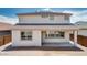 Rear exterior view showcasing the covered patio and stucco finish at 9054 S 169Th Dr, Goodyear, AZ 85338