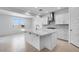 Bright kitchen featuring white cabinets, stainless steel appliances, and a large island at 9054 S 169Th Dr, Goodyear, AZ 85338