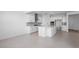 Bright kitchen featuring white cabinets, stainless steel appliances, and a large island at 9054 S 169Th Dr, Goodyear, AZ 85338