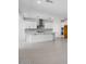 Spacious, modern kitchen with white cabinets, stainless steel appliances and a large center island at 9054 S 169Th Dr, Goodyear, AZ 85338