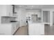 Bright kitchen featuring white cabinets, stainless steel appliances, and a large island at 9054 S 169Th Dr, Goodyear, AZ 85338