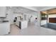 Bright open kitchen boasts stainless steel appliances, center island and tile flooring at 9054 S 169Th Dr, Goodyear, AZ 85338