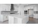 Bright kitchen featuring white cabinets, stainless steel appliances, and a large island at 9054 S 169Th Dr, Goodyear, AZ 85338