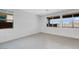 Bright living room featuring wood floors and three large windows at 9054 S 169Th Dr, Goodyear, AZ 85338