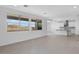 Spacious living room with a large island kitchen in the background at 9054 S 169Th Dr, Goodyear, AZ 85338