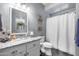 Bathroom boasts granite countertops and updated fixtures at 9100 E Raintree Dr # 232, Scottsdale, AZ 85260