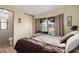 Cozy bedroom with a comfortable bed and ensuite bathroom at 9333 E University Dr # 86, Mesa, AZ 85207