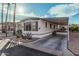 Front view of the manufactured home with carport and landscaping at 9333 E University Dr # 86, Mesa, AZ 85207