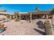 Spacious backyard boasts a covered patio and desert landscaping, offering a perfect retreat for outdoor living at 10139 E Copper Dr, Sun Lakes, AZ 85248