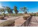 Scenic view of the golf course with lush greenery and mature trees at 10139 E Copper Dr, Sun Lakes, AZ 85248