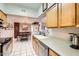 Functional kitchen with light wood cabinets, stainless steel appliances, and tiled floor at 10401 N Saguaro Blvd # 118, Fountain Hills, AZ 85268