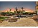 Peaceful backyard at sunset with a fire pit and pool at 10410 N 74Th Pl, Scottsdale, AZ 85258