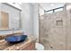 Modern bathroom with a glass shower and stylish sink at 10410 N 74Th Pl, Scottsdale, AZ 85258