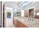 Double vanity bathroom with modern fixtures and natural light at 10410 N 74Th Pl, Scottsdale, AZ 85258