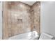 Clean bathroom with tiled shower and bathtub at 10410 N 74Th Pl, Scottsdale, AZ 85258