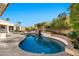 Relaxing kidney-shaped pool with a tiled water feature at 10410 N 74Th Pl, Scottsdale, AZ 85258