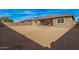 Spacious backyard with desert landscaping and block fence offering ample space for outdoor enjoyment at 10501 W Swayback Pass, Peoria, AZ 85383