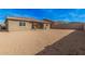 Expansive backyard featuring low-maintenance desert landscaping and block fence, offering privacy at 10501 W Swayback Pass, Peoria, AZ 85383