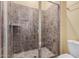 Bathroom with a shower, neutral color palette, and tiled surround at 10501 W Swayback Pass, Peoria, AZ 85383