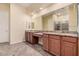 Bathroom with double sink vanity, granite counters and tiled floor at 10501 W Swayback Pass, Peoria, AZ 85383